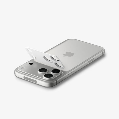 AGL10652 - iPhone 17 Pro Max Optik Pro XL EZ Fit Lens Protector in silver showing the back and partial side with lens screen protector partially hovering above