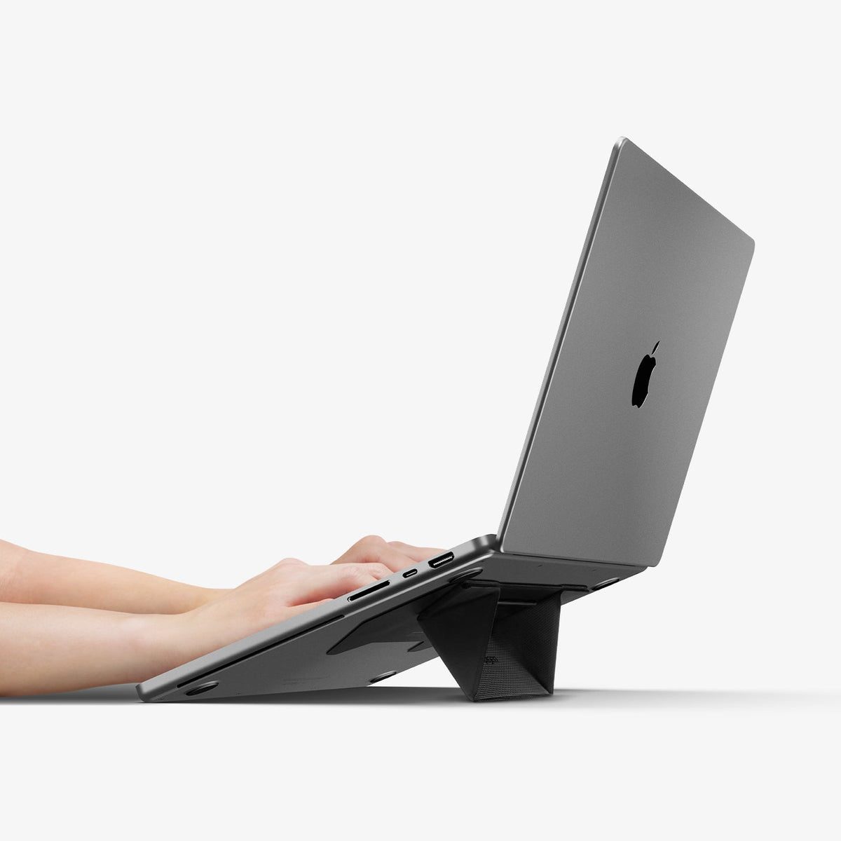 AMP10403 - Slim Fold Laptop Stand | LD201-S3 showing someone typing on laptop propped up by stand