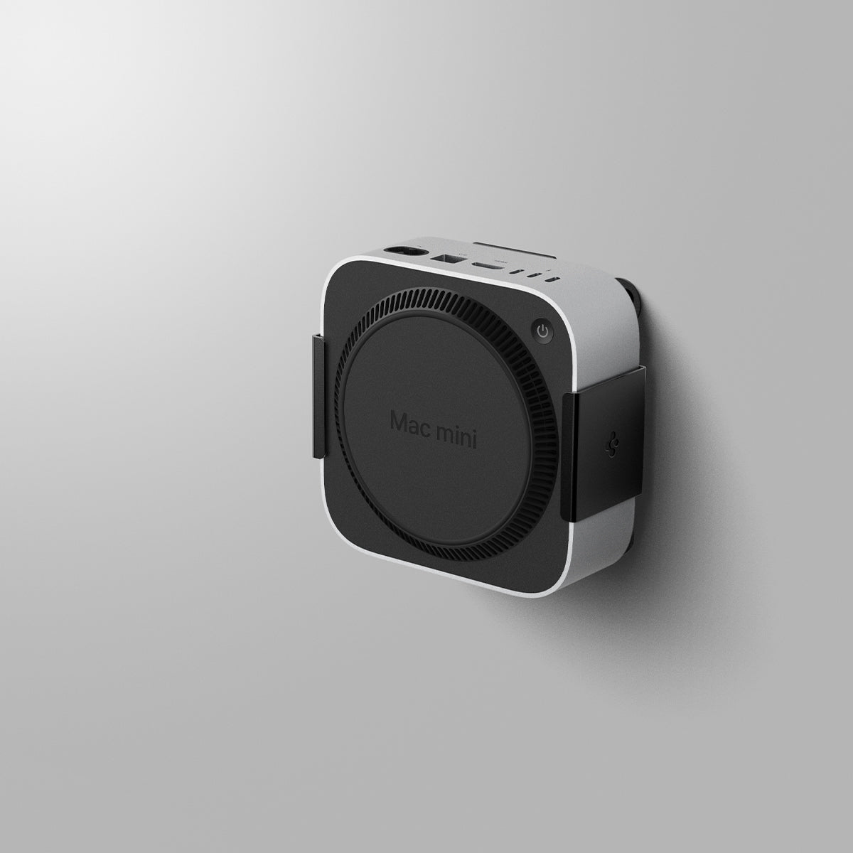 AMP09226 - Mac Mini M4 Mount LD205 in Charcoal Gray showing the front and partial sides mounted on a wall