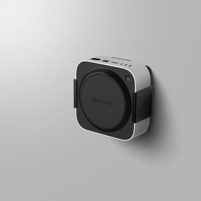 AMP09226 - Mac Mini M4 Mount LD205 in Charcoal Gray showing the front and partial sides mounted on a wall