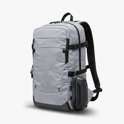 ACS09444 - [LF520] Universal Sunglass Case in Black showing the hard-shell case attached to the side of a gray backpack using a metal carabiner for convenient carry.
