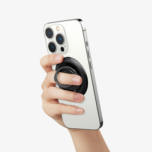 AMP05505 - O-Mag Magnetic Phone Holder (MagFit) in carbon showing the O-Mag attached to the back of device and hand using the ring for stability