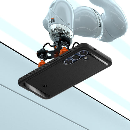 ACS08998 - Galaxy S25 Case Rugged Armor (MagFit) in Matte Black showing the back, partial side and top with robot sitting on top of the device