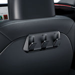 ACP09201 - Tesla Model 3 (2017-2023) Car Seat Hook TO283 in Black showing the front partial side installed at the back of the driver's seat