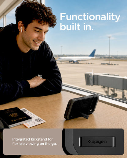 ACS11433 - Pixel 11 Pro Tough Armor (Mag Fit) Black case standing with the built in kickstand for hands free viewing on a table.