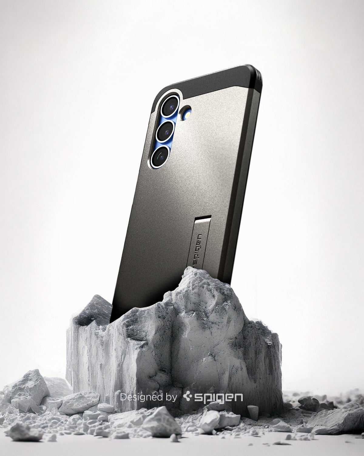 ACS09009 - Galaxy S25 Case Tough Armor AI (MagFit) in Gunmetal showing the back, partial side device sitting on the top of a rock